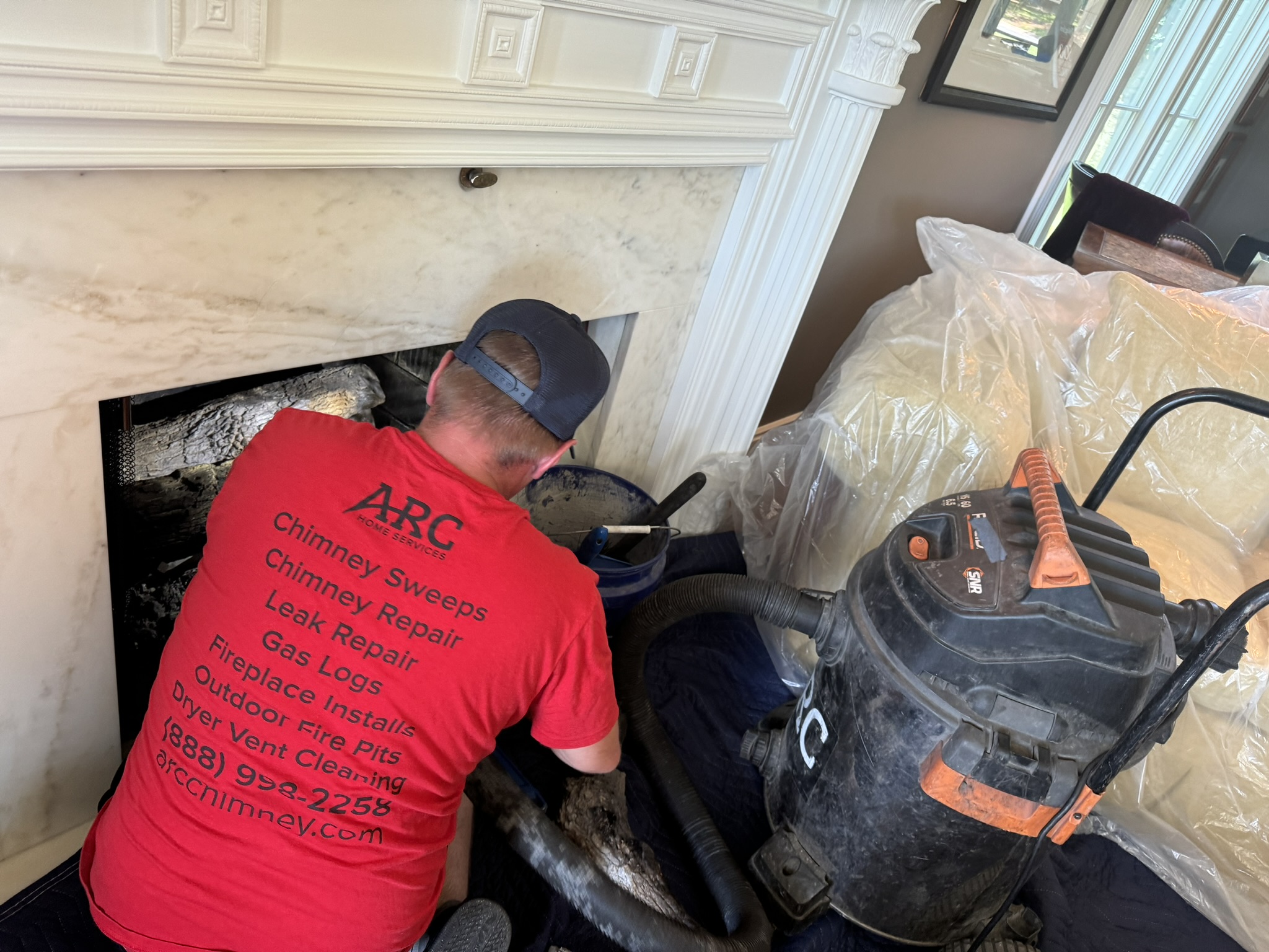 ARC Chimney Sweeps technician at work on a clean hearth